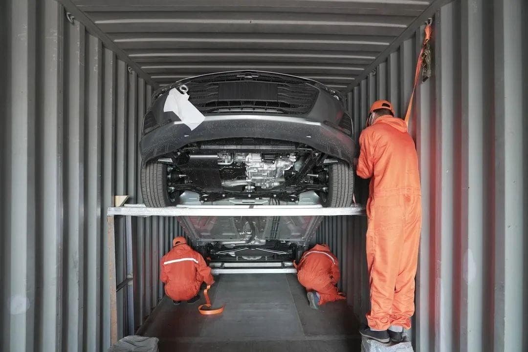 Vehicle being secured inside a shipping container